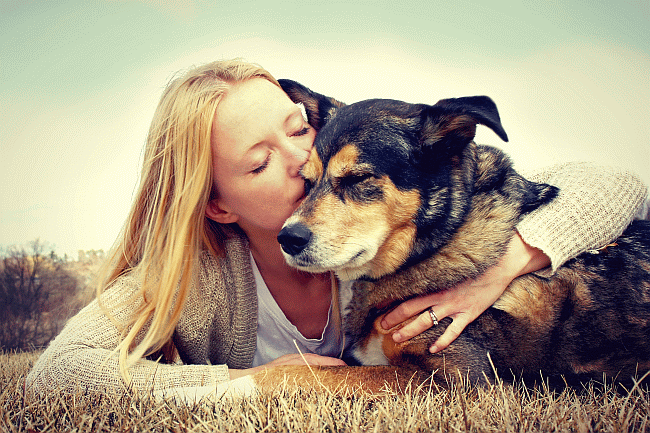 woman hugging dog